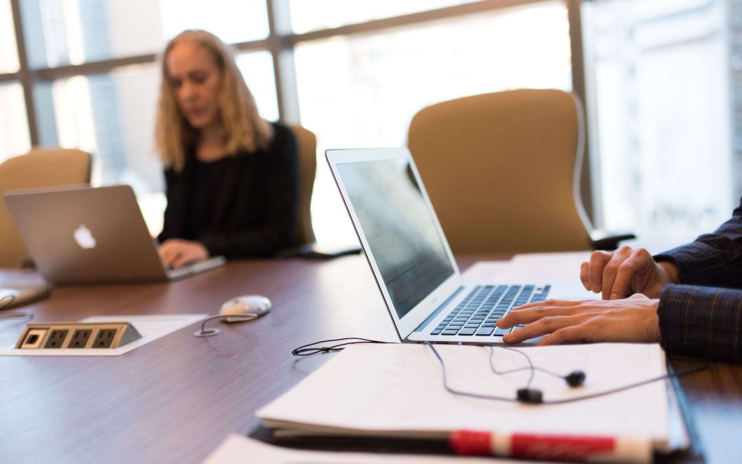 IT professional reviewing network infrastructure with a business client, representing proactive managed IT services and strategic partnership