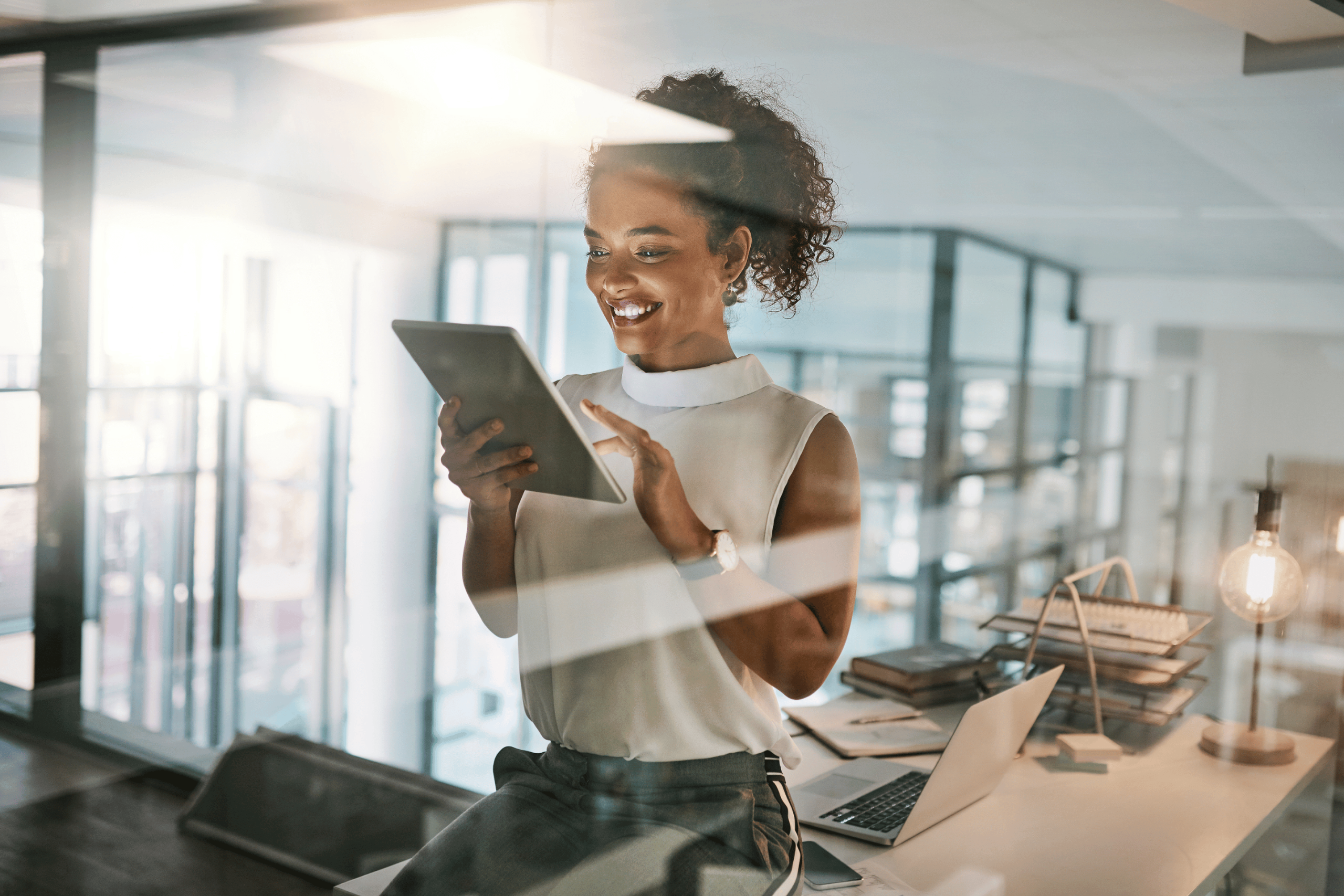 Business Manager on Tablet Managing Multiple Businesses with the Help of ICS Multi-Location IT Expertise